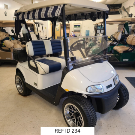 E-Z-GO RXV Elite golf cart in bright white with custom two-tone seats and enclosure