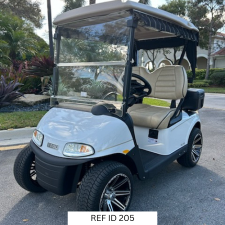 2022 Bright White E-Z-GO RXV Elite golf cart with custom seats, 14-inch wheels, and custom enclosure