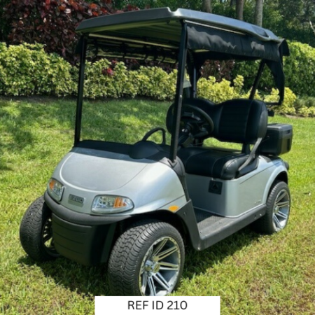 Platinum E-Z-GO RXV Elite golf cart with 14-inch wheels, premium seats, and Sunbrella enclosure